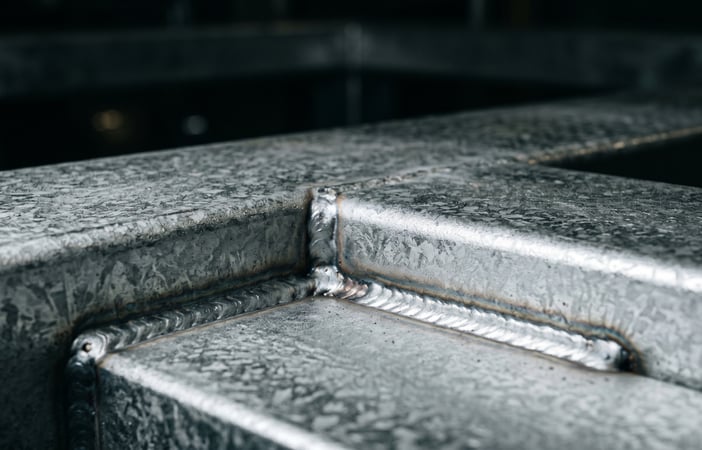 close up of steel shelving pieces coming together